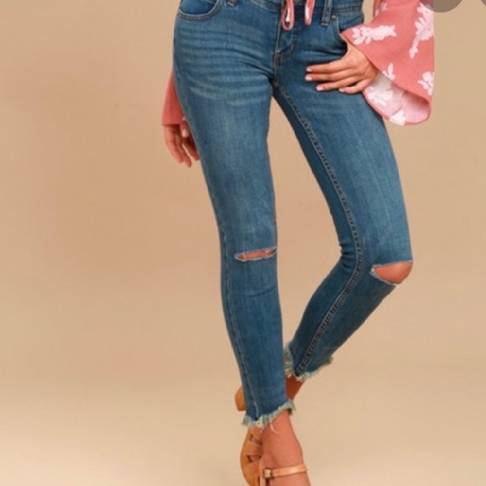 Frayed and distressed free people jeans